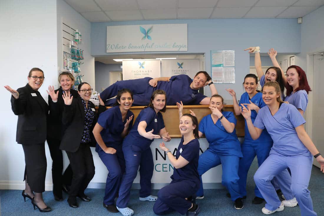 Thornaby Dental Centre Team Posing Happy After Getting an Explosion of New Invisalign Cases from Facebook Advertising with the Help of Ignite Growth