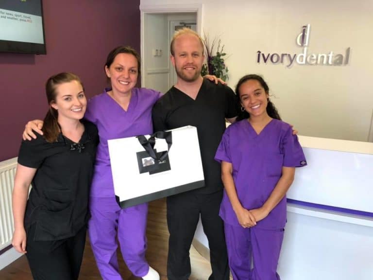 Ivory Dental Team Posing Happy After Successful Marketing Strategy Implementation