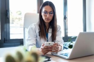 medical professional texting to successfully boost patient lead conversion